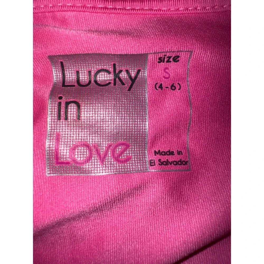 Lucky In Love pink ruffled‎ skort with undershorts and a 4